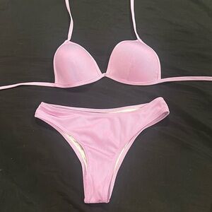 Purple swimsuit bottom and top, bottoms are medium and top is small